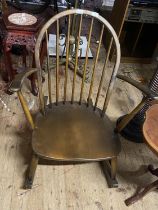 A vintage Ercol low slung rocking chair, shipping unavailable