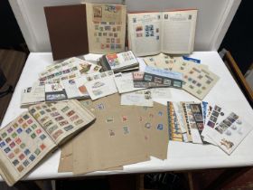 A large selection of assorted first day covers, stamp albums and other