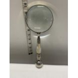 A large silver plated and MOP handled magnifying glass