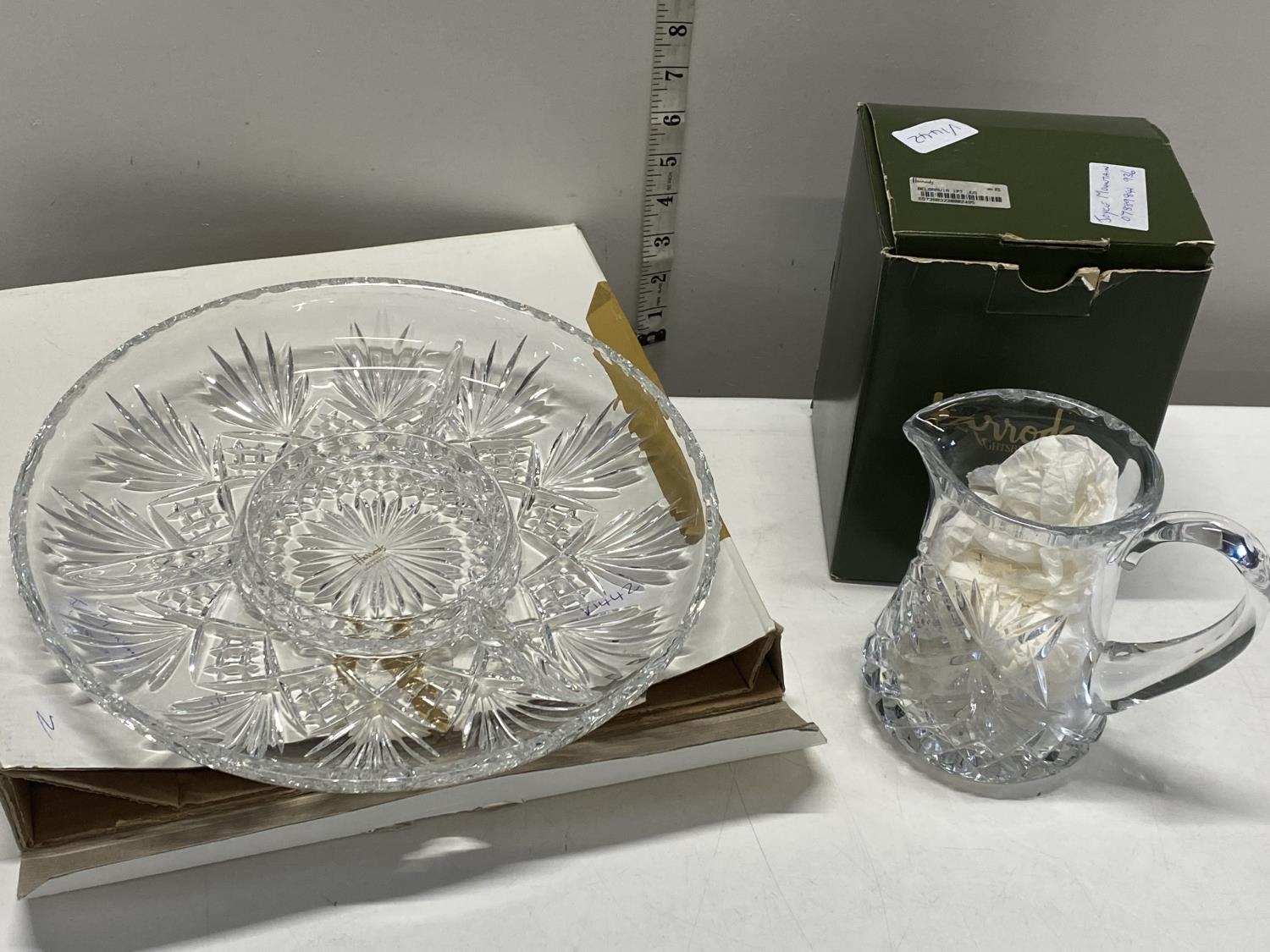 A boxed cut glass dish and jug retailed by Harrods of London