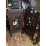 A antique wooden firescreen with applied decoration, shipping unavailable