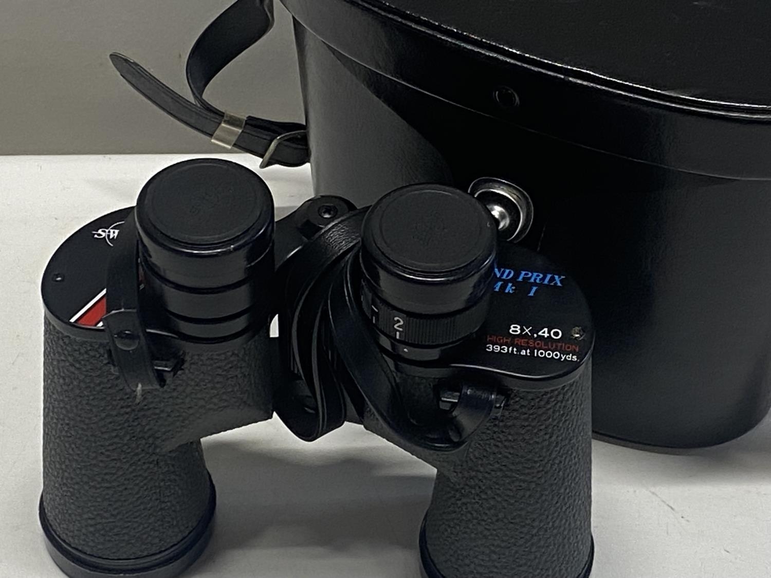 A cased pair of Swift 8x40 binoculars