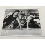 A signed photograph depicting Sylvester Stallone with unknown signature