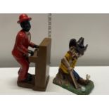 A vintage ceramic figure and a wooden figure of a cowboy