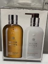 A sealed Molton Brown shower and body lotion set