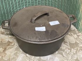 A heavy cast iron cooking pot and cover, shipping unavailable