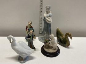 A selection of assorted figurines including Nao and Country Artists