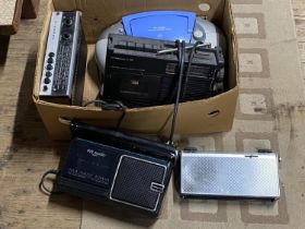 A box of assorted radios, CD players etc