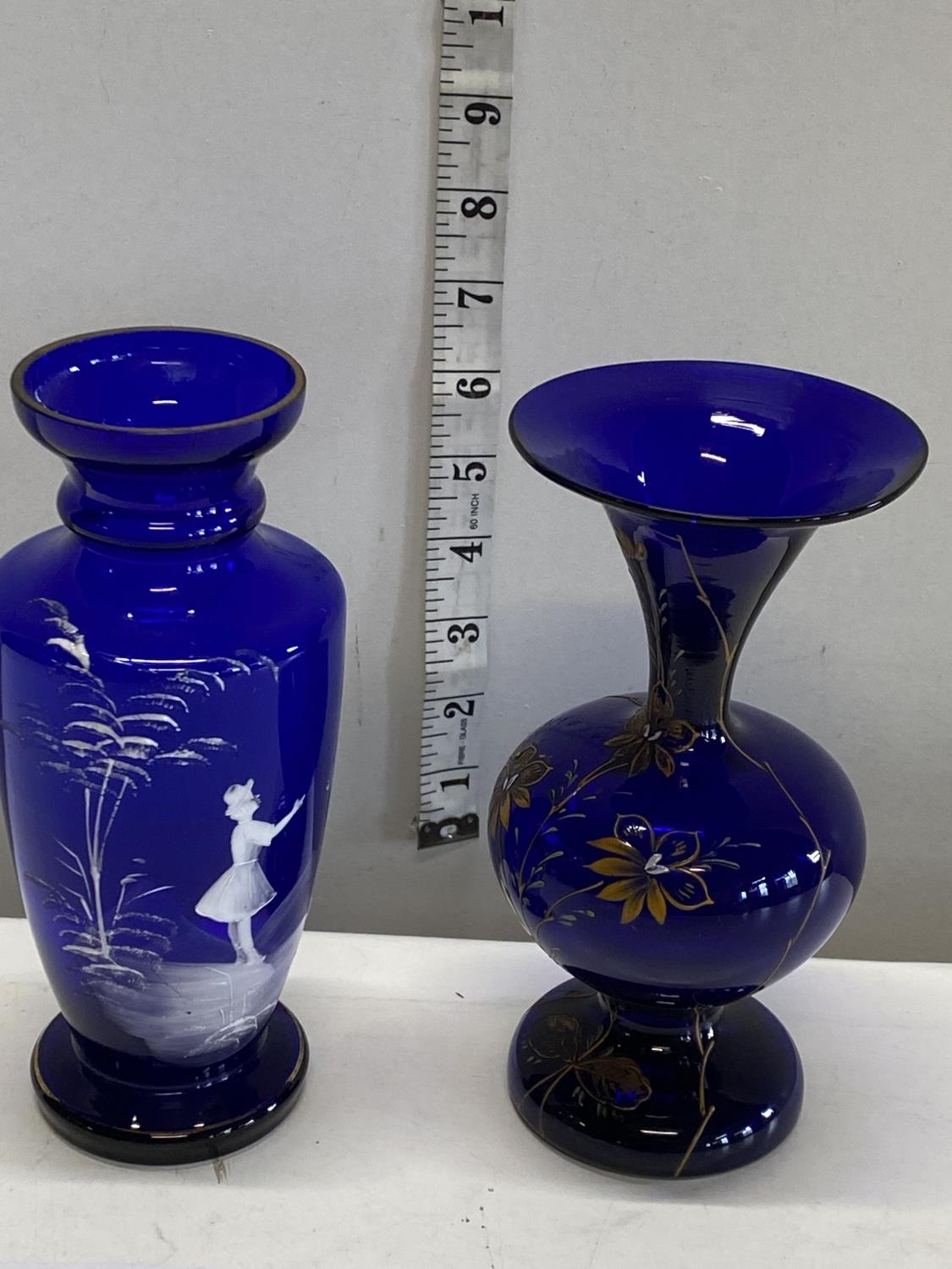 A Mary Gregory style blue vase and a Bohemian blue vase