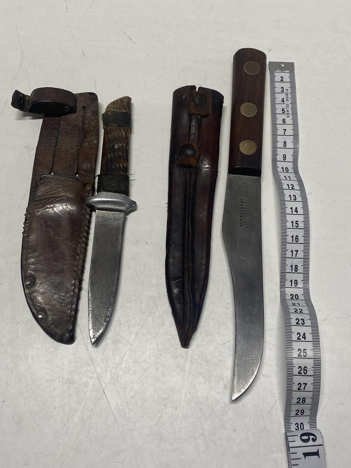 A vintage horn handled knife in sheath and a wooden handled knife with sheath by Renwick and Co