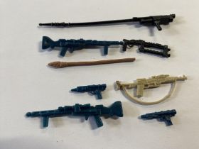 A selection of vintage Star Wars weapons and accessories