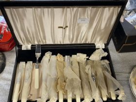 A vintage cased cutlery set