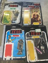 Four empty vintage Star Wars blister packs