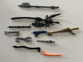 A selection of vintage Star Wars weapons and accessories