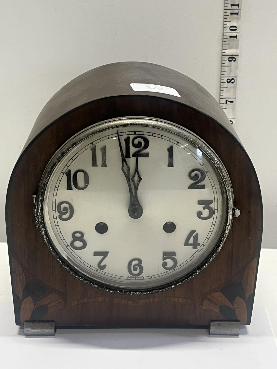 A Art Deco period mantle clock with key and pendulum, shipping unavailable