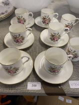 A Royal Worcester bone china coffee set with two additional coffee cans