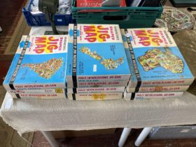 Eleven boxed Waddington's Jig-Maps (unchecked)