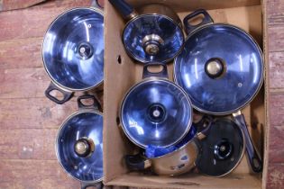 An assortment of 'Happy Lady' kitchen pans, shipping unavailable