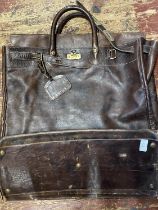 A large vintage leather holdall with Liberty label to the interior