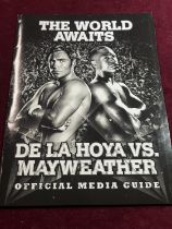 A hand signed Oscar de la Hoya VS Floyd Mayweather Junior media pack with hand signed contents and
