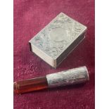 A hallmarked silver cheroot holder with Amber mouthpiece and a hallmarked silver matchbox holder
