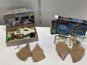 A 1983 Star Wars boxed Ewok Combat Glider and one unboxed with a A-Wing fighter airfix model