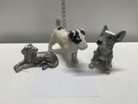 Three assorted dog figurines