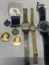 A selection of assorted watches, coins and two hallmarked silver medals