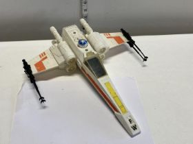 A vintage Star Wars X Wing Fighter model by Kenner
