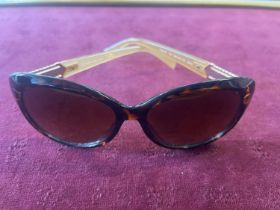 A pair of Karen Millen sunglasses