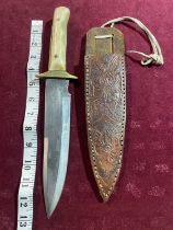 A large horn handled hunting knife in a leather sheath. Blade length 21cm. over 18's / UK post only