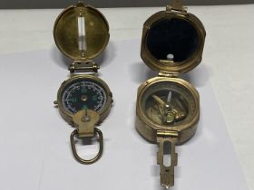 Two military style compasses.