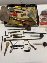 A selection of assorted gun related tools and accessories including black powder measure
