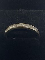 A ladies 18ct white gold diamond set band ring. With Princess cut diamonds. Gross weight of ring 1.9