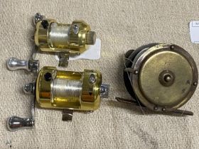 Three small brass fishing reels