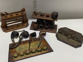 A large selection of antique pipes and pipe racks