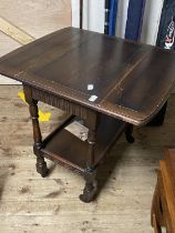 A antique drop leaf table on castors with shelf under. 68cm x 44cm closed size. No shipping.