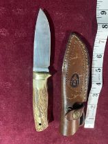 A Muela Kodiak hunting knife in a leather sheath. Blade length 10cm. over 18's / UK post only