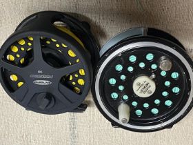 A Shakespear fixed spool fishing reel and a Ron Thompson fixed spool fishing reel.