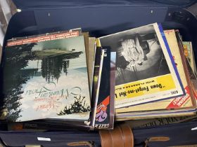 A suitcase full of mixed genre LP records