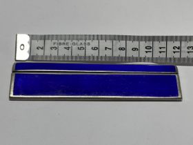 A hallmarked silver & blue enamelled comb (damage to comb)