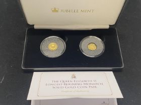 A limited edition pair of 9ct gold proof coins celebrating The Queen Elizabeth II longest reigning