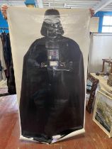 A large life size Darth Vader Star Wars poster