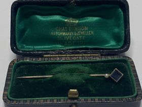 A antique 15ct gold stick pin in original case. Weight 1.42 grams