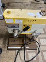 A 240 volt bench drill. Untested. No shipping