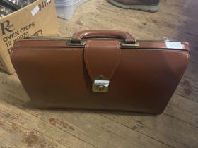 A vintage brown leather attache case