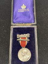 A cased silver 1912 King George V medal.