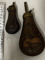 Two small antique copper black powder flasks