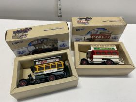 Two boxed Corgi bus models