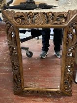 A antique hand carved oak mirror with bevelled edge glass. 80cm x 58cm shipping unavailable